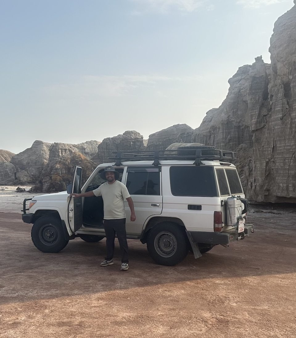 Mulugeta Demssie with a MUKA tour vehicle